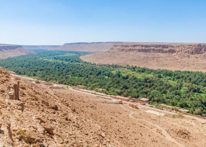 Private transfer from Errachidia Airport through scenic Ziz Valley palm groves to Merzouga desert camp